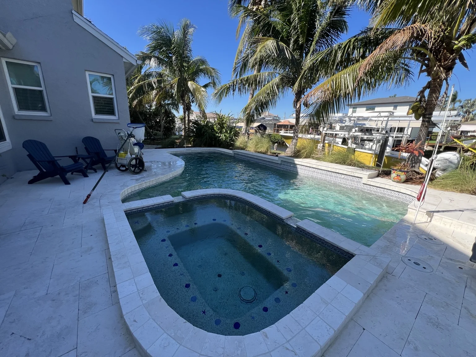 A waterfront residential pool serviced by K&V Pools